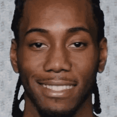 A Close Up Of A Man 'S Face With Braids And A Smile On His Face . GIF
