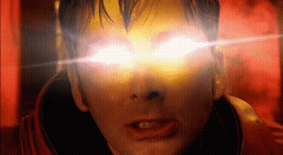 A Close Up Of A Man 'S Face With Bright Yellow Eyes GIF