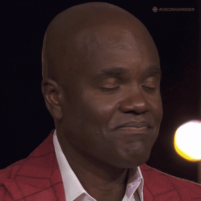 A Close Up Of A Man 'S Face With #Cbcdragonsden On The Bottom GIF