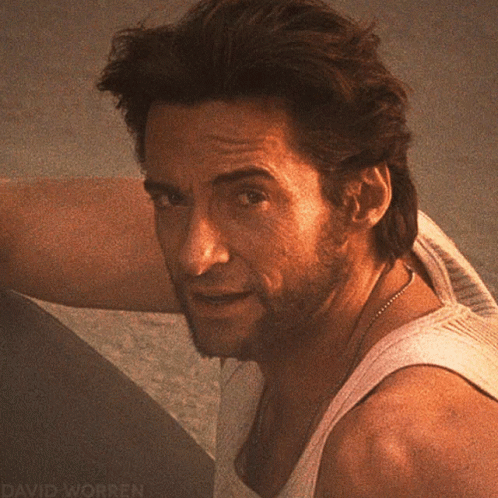 A Close Up Of A Man 'S Face With David Worren Written On The Bottom Right GIF
