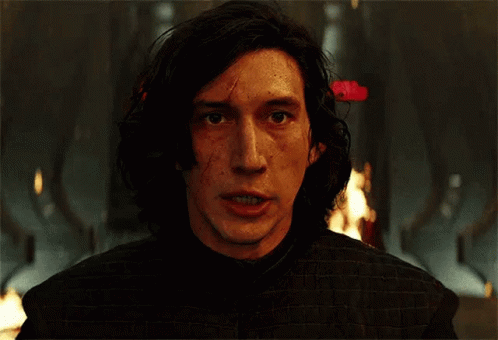 A Close Up Of A Man 'S Face With Fire In The Background . GIF