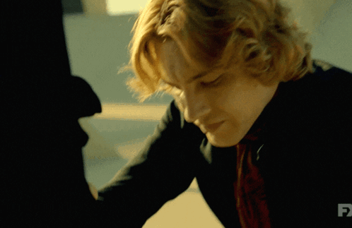 A Close Up Of A Man 'S Face With Fx Written On The Bottom GIF