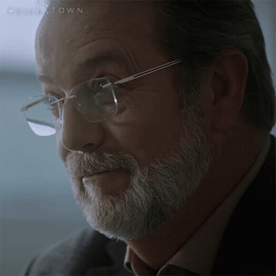 A Close Up Of A Man 'S Face With Glasses And A Beard With The Hashtag #Disestown On The Bottom GIF
