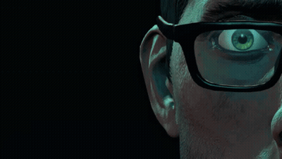 A Close Up Of A Man 'S Face With Glasses And A Green Eye GIF