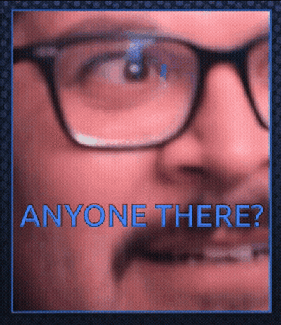 A Close Up Of A Man 'S Face With Glasses And The Words " Anyone There " GIF