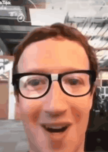 A Close Up Of A Man 'S Face With Glasses On GIF