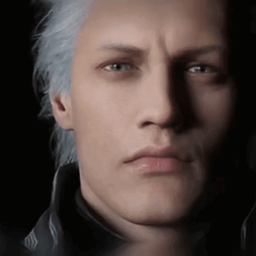 A Close Up Of A Man 'S Face With Gray Hair And A Black Jacket . GIF