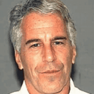 A Close Up Of A Man 'S Face With Gray Hair And A White Shirt GIF