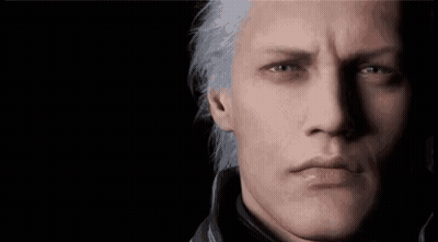 A Close Up Of A Man 'S Face With Gray Hair And Blue Eyes . GIF