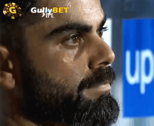 A Close Up Of A Man 'S Face With Gullybet Ipl Written On The Top GIF