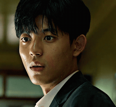 A Close Up Of A Man 'S Face With His Eyes Closed GIF