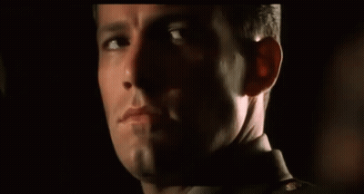 A Close Up Of A Man 'S Face With His Eyes Closed GIF