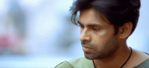A Close Up Of A Man 'S Face With His Eyes Closed GIF