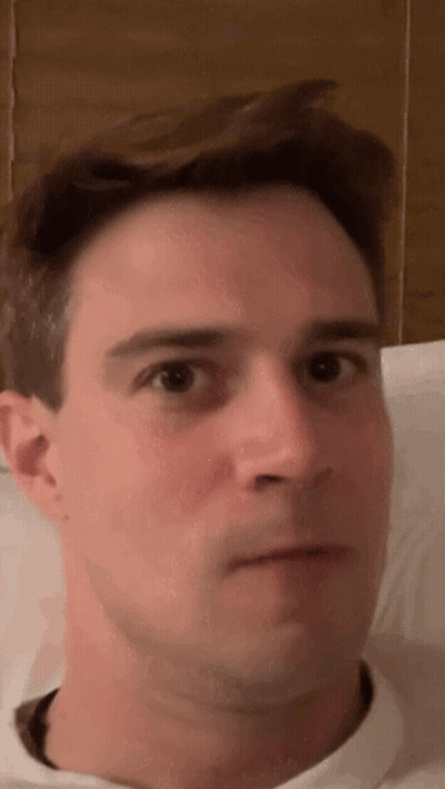 A Close Up Of A Man 'S Face With His Eyes Closed . GIF