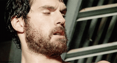 A Close Up Of A Man 'S Face With His Eyes Closed And A Beard With The Word Simply On The Bottom GIF