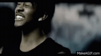 A Close Up Of A Man 'S Face With His Eyes Closed And A Smile On His Face . GIF