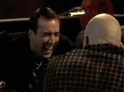 A Close Up Of A Man 'S Face With His Eyes Closed And His Hand On His Forehead GIF