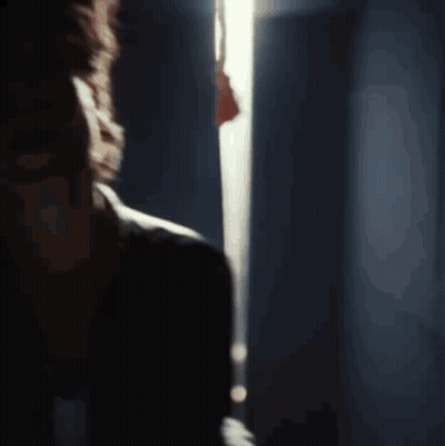 A Close Up Of A Man 'S Face With His Eyes Closed And His Mouth Open GIF