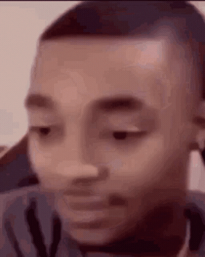 A Close Up Of A Man 'S Face With His Eyes Closed And His Mouth Open . GIF
