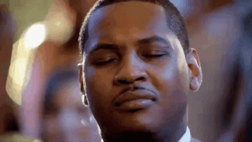 A Close Up Of A Man 'S Face With His Eyes Closed And His Mouth Open . GIF