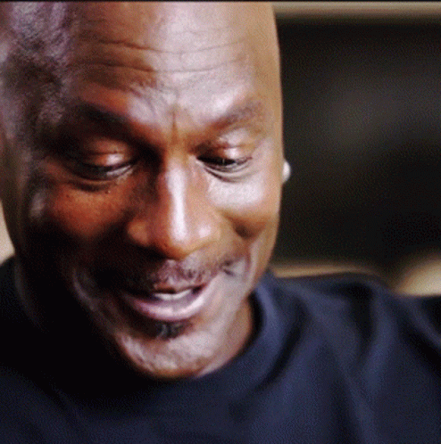 A Close Up Of A Man 'S Face With His Eyes Closed And His Mouth Open GIF