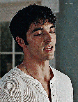 A Close Up Of A Man 'S Face With His Eyes Closed And His Mouth Open . GIF