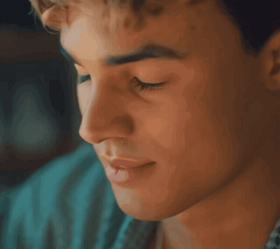A Close Up Of A Man 'S Face With His Eyes Closed And His Mouth Open GIF