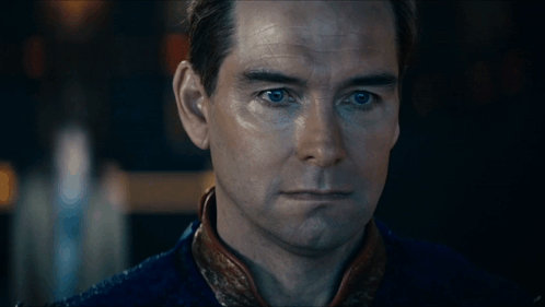 a close up of a man 's face with his eyes closed