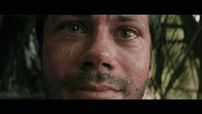 A Close Up Of A Man 'S Face With His Eyes Closed GIF