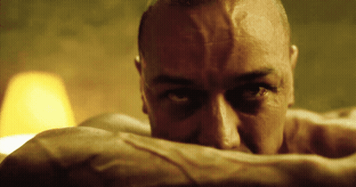 A Close Up Of A Man 'S Face With His Eyes Closed GIF