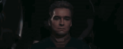 A Close Up Of A Man 'S Face With His Eyes Closed . GIF