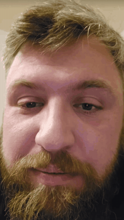 A Close Up Of A Man 'S Face With His Eyes Closed GIF