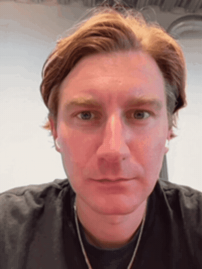 A Close Up Of A Man 'S Face With His Eyes Closed GIF