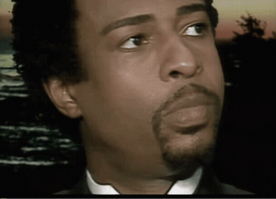 A Close Up Of A Man 'S Face With His Eyes Closed GIF