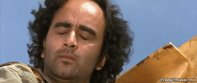 A Close Up Of A Man 'S Face With His Eyes Closed GIF