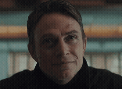 A Close Up Of A Man 'S Face With His Eyes Closed GIF