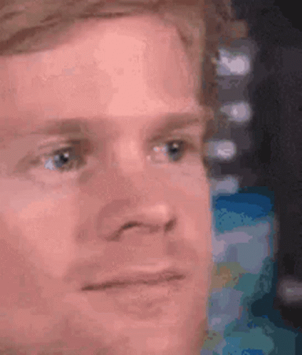A Close Up Of A Man 'S Face With His Eyes Closed . GIF