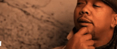 A Close Up Of A Man 'S Face With His Eyes Closed GIF