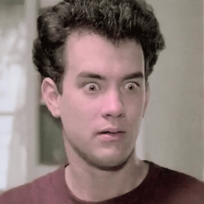 A Close Up Of A Man 'S Face With His Eyes Wide Open And A Surprised Look On His Face . GIF