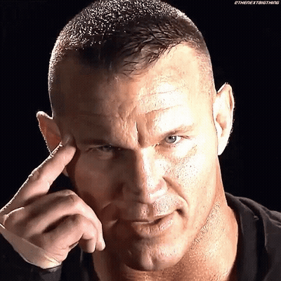 A Close Up Of A Man 'S Face With His Finger To His Forehead . GIF