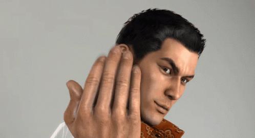A Close Up Of A Man 'S Face With His Hands Behind His Ear GIF