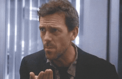 A Close Up Of A Man 'S Face With His Hands Out GIF