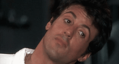A Close Up Of A Man 'S Face With His Head Turned GIF