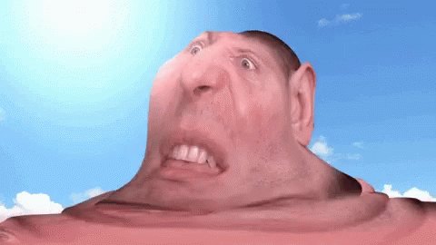 A Close Up Of A Man 'S Face With His Mouth Open GIF
