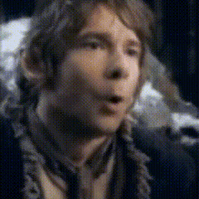 A Close Up Of A Man 'S Face With His Mouth Open And A Blurred Background . GIF