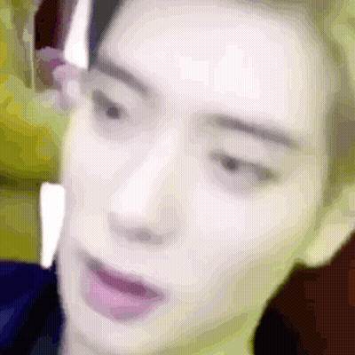 A Close Up Of A Man 'S Face With His Mouth Open And A Blurry Background . GIF