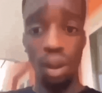 A Close Up Of A Man 'S Face With His Mouth Open And A Blurry Background . GIF