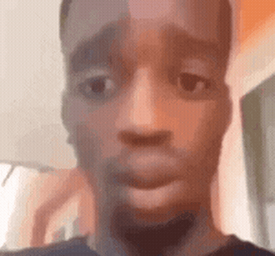 A Close Up Of A Man 'S Face With His Mouth Open And A Surprised Look On His Face . GIF