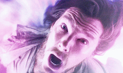 A Close Up Of A Man 'S Face With His Mouth Open And A Surprised Look On His Face . GIF