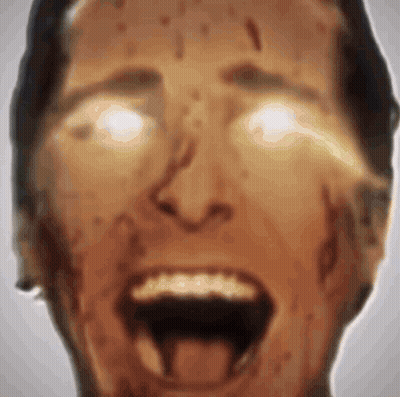 A Close Up Of A Man 'S Face With His Mouth Open And Blood Coming Out Of His Mouth . GIF